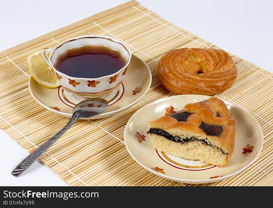 Tea with lemon and pastry.