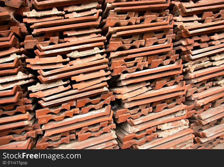 Old red roof tiles ready to be re-used. Old red roof tiles ready to be re-used