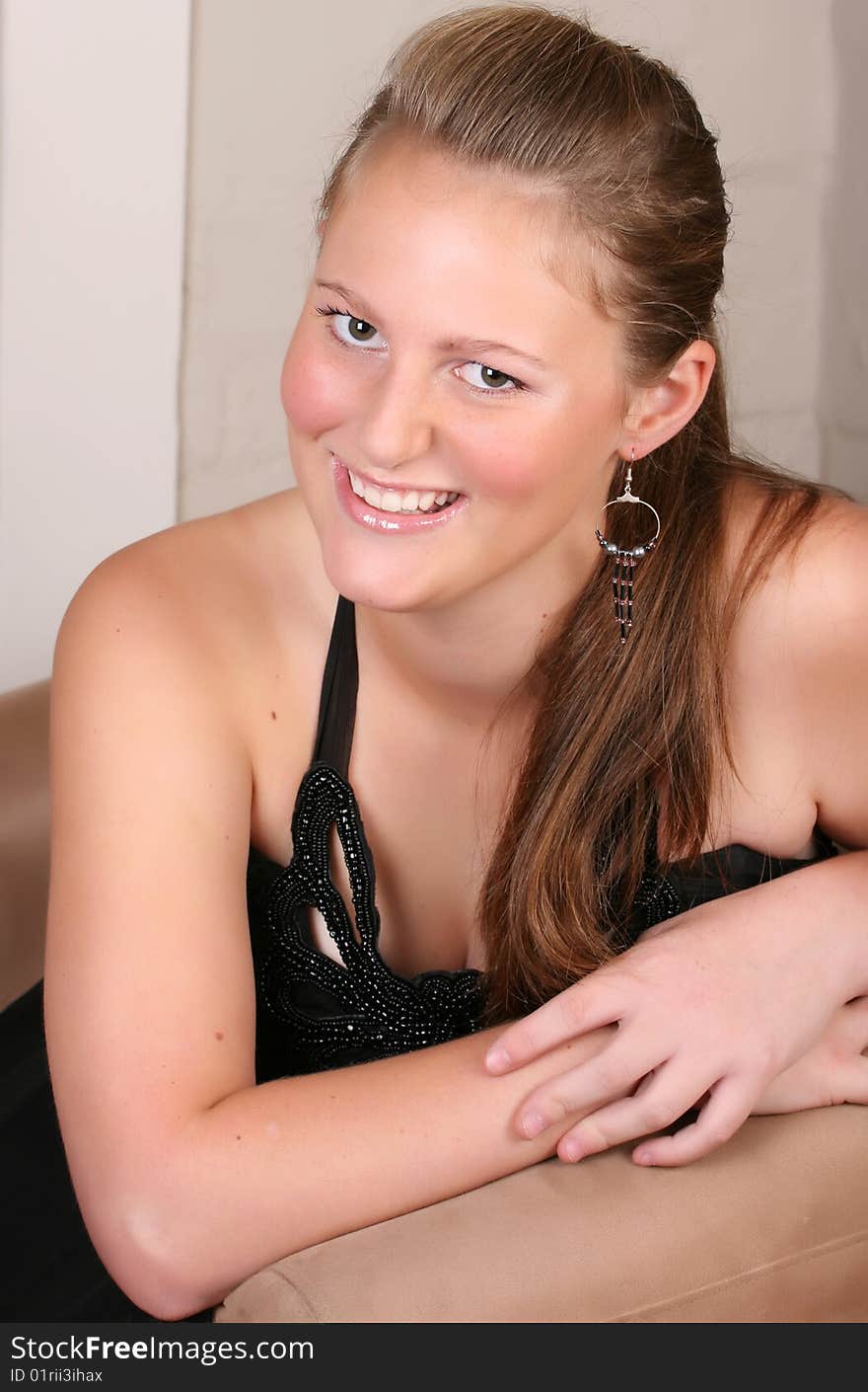 Close up of female teenager against a light background. Close up of female teenager against a light background