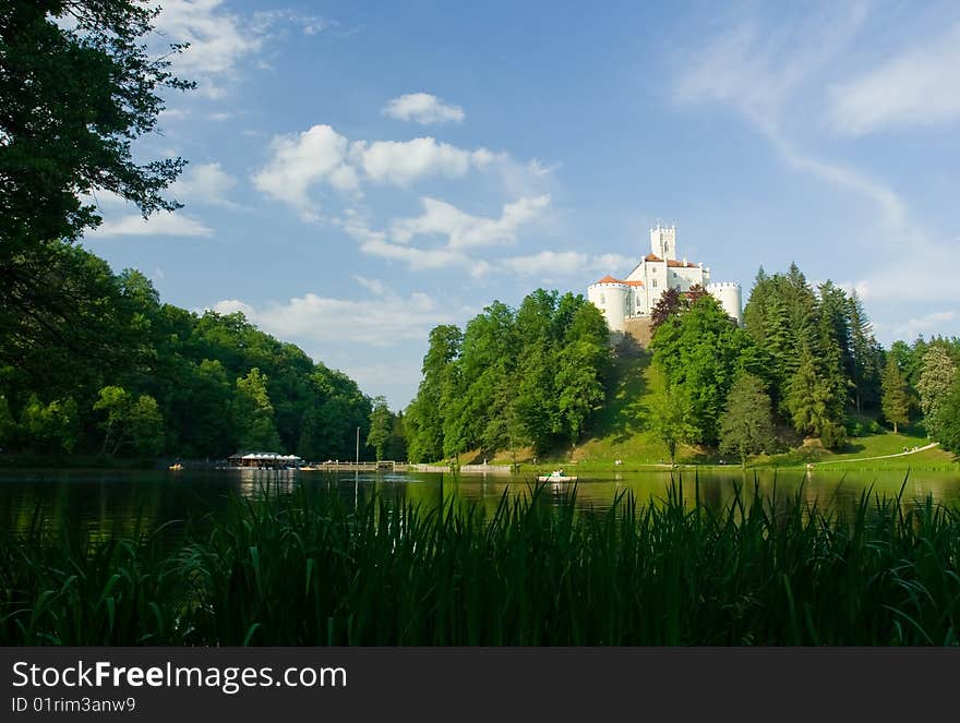 Medieval castle over lake scene