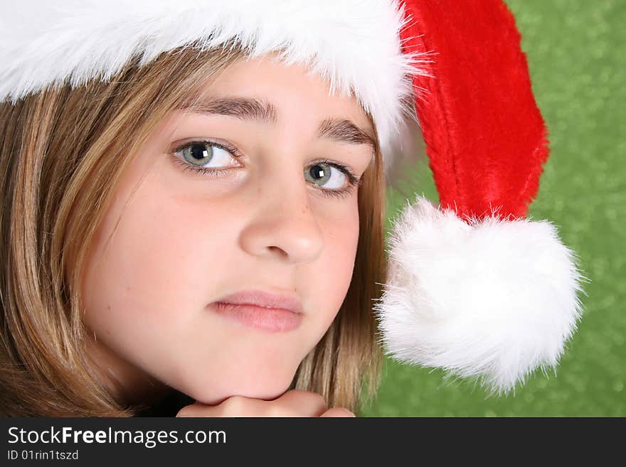 Beautiful teenager girl wearing a christmas hat. Beautiful teenager girl wearing a christmas hat