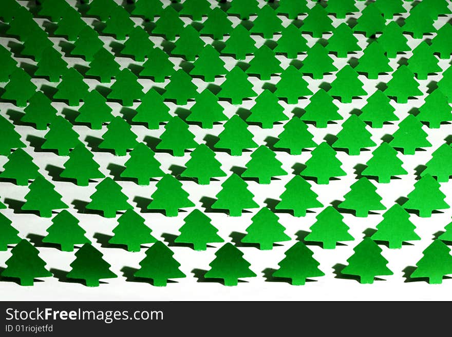 Green paper trees against white background