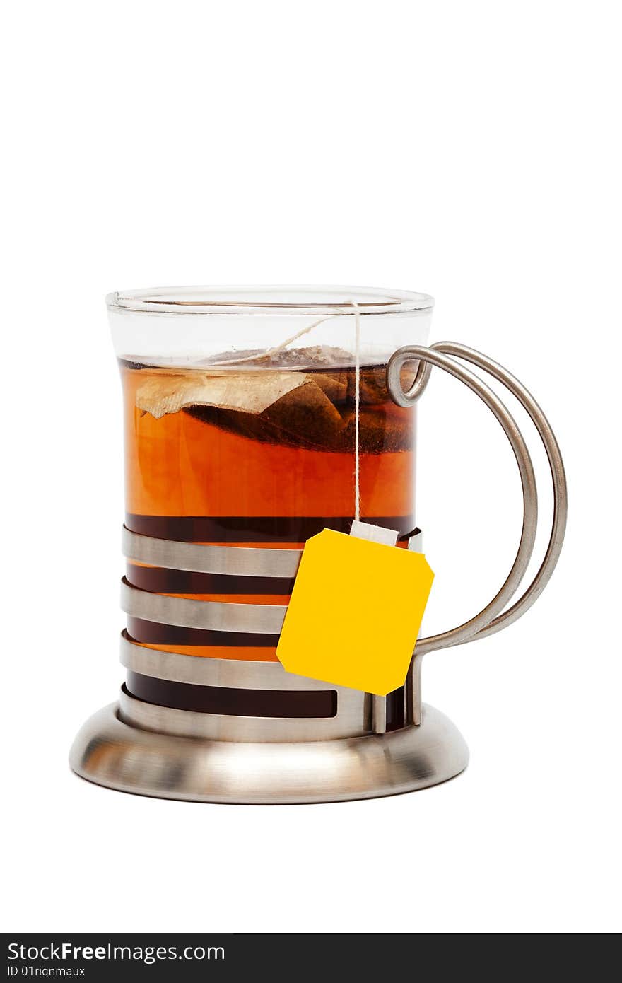 Tea in a glass with a cup holder on a white background