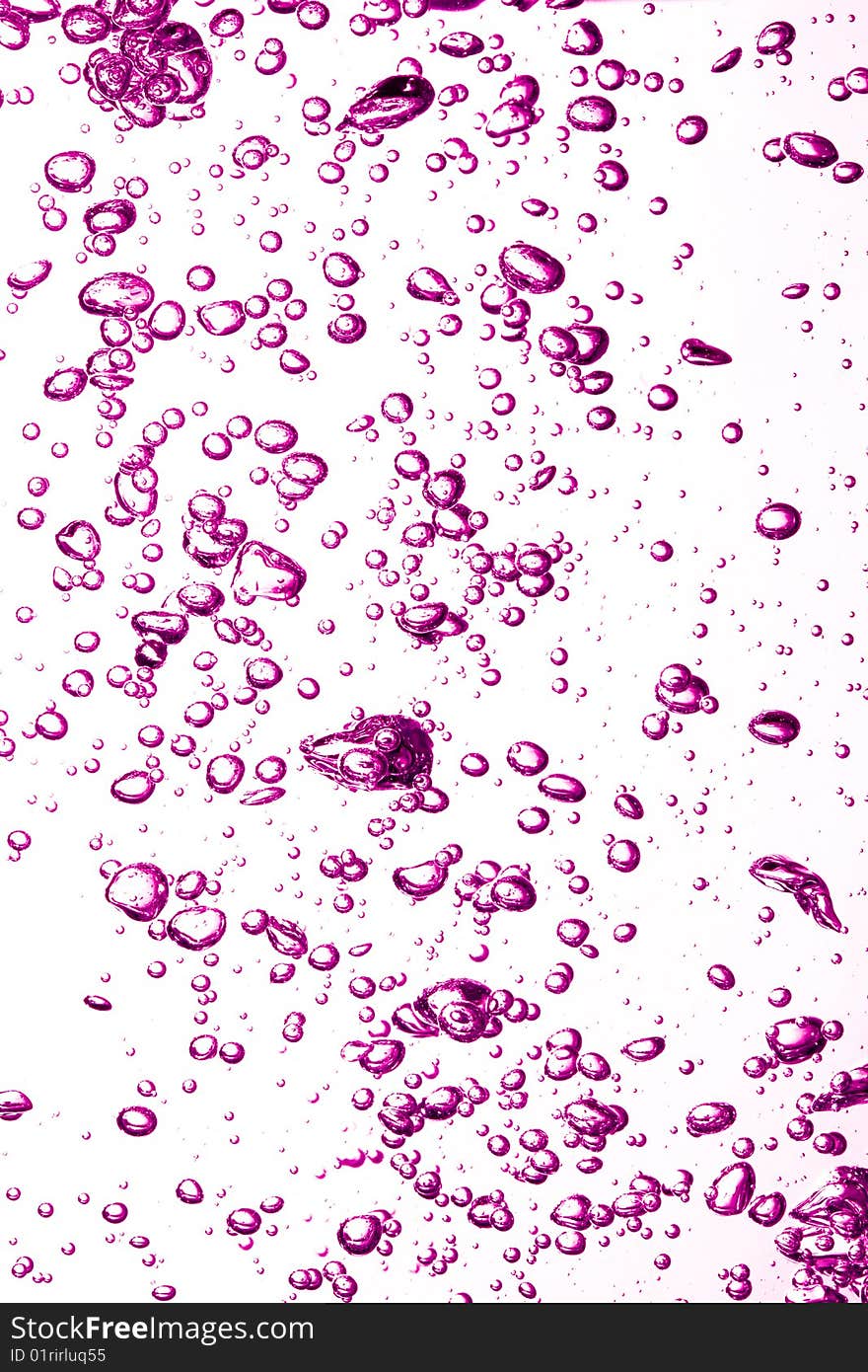 Pink Air bubbles underwater against white background. Pink Air bubbles underwater against white background