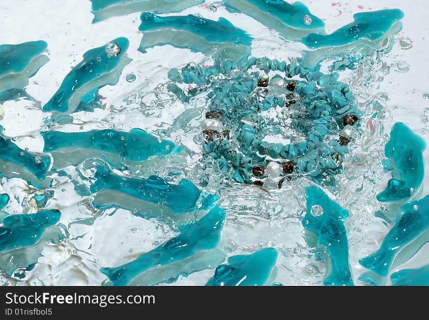 Azure necklace splash in water. Azure necklace splash in water