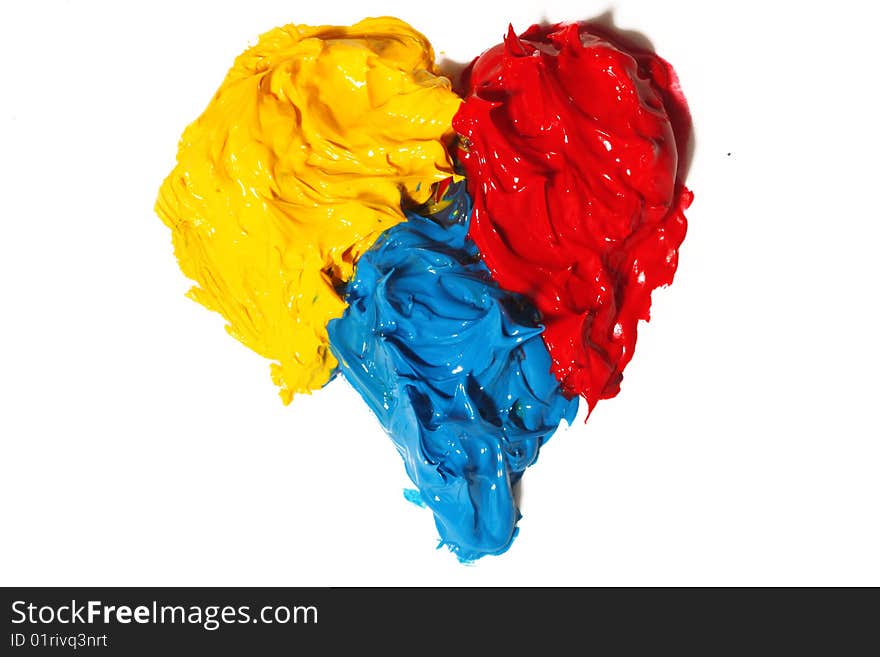 Primary colors oil paint making a heart isolated. Primary colors oil paint making a heart isolated