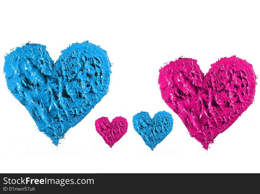 Blue and pink oil paint  making heart isolated. Blue and pink oil paint  making heart isolated