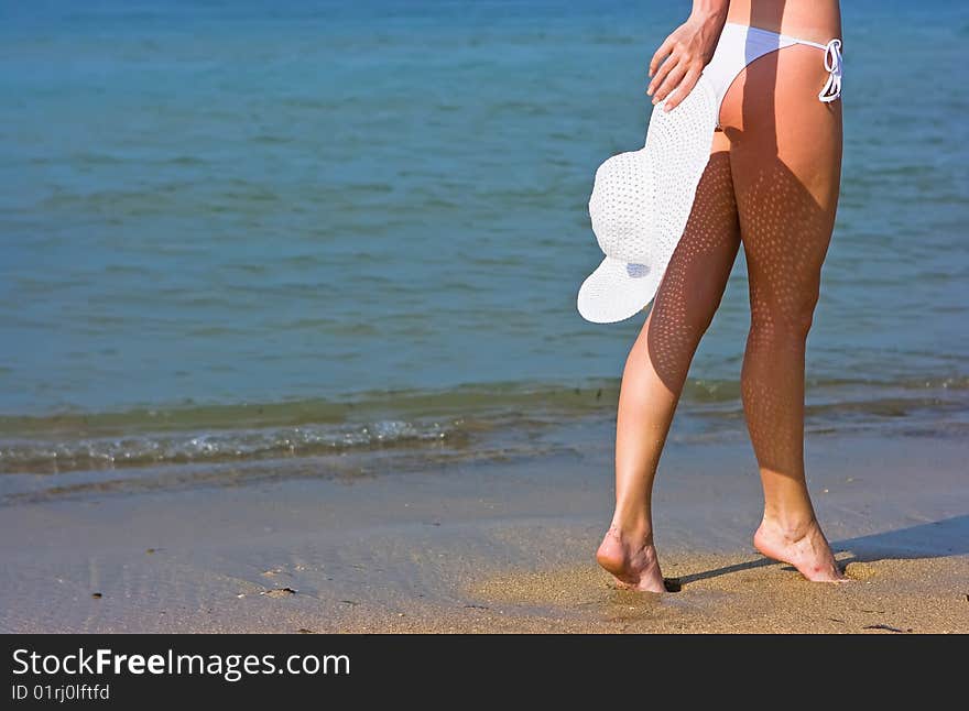 White hat on the beach