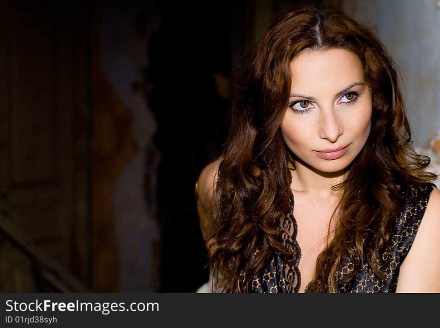 Portrait of glam girl with curly on ruins background. Portrait of glam girl with curly on ruins background