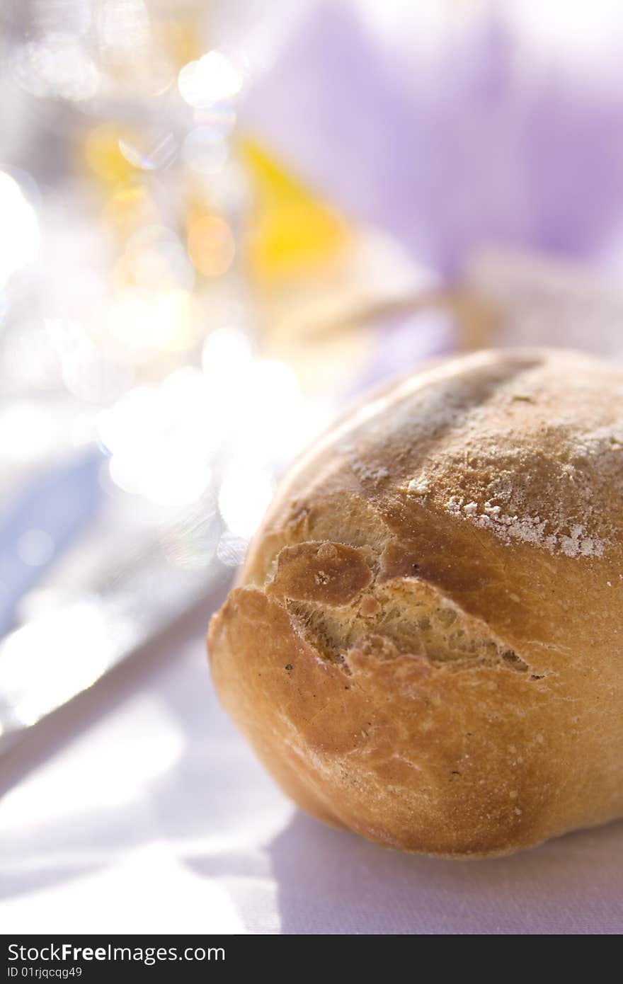 Fresh bread on the table in the sun