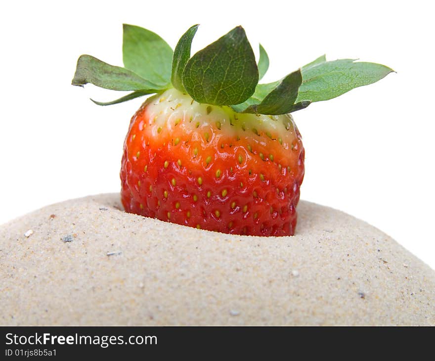 Strawberry in sand  isolated on white background.