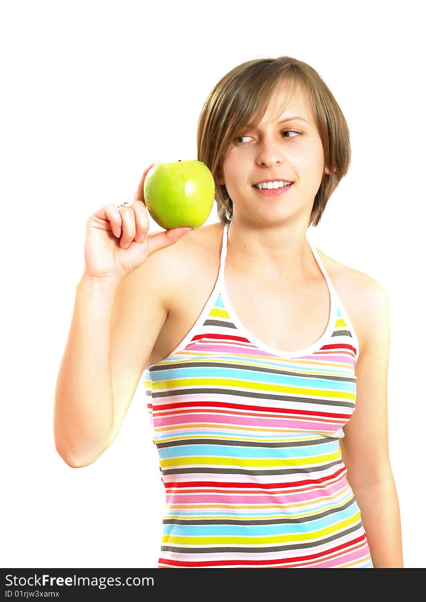 Portrait of a pretty Caucasian blond girl with a nice colorful striped dress who is smiling and she is holding a green apple in her hand. Isolated on white. Portrait of a pretty Caucasian blond girl with a nice colorful striped dress who is smiling and she is holding a green apple in her hand. Isolated on white.