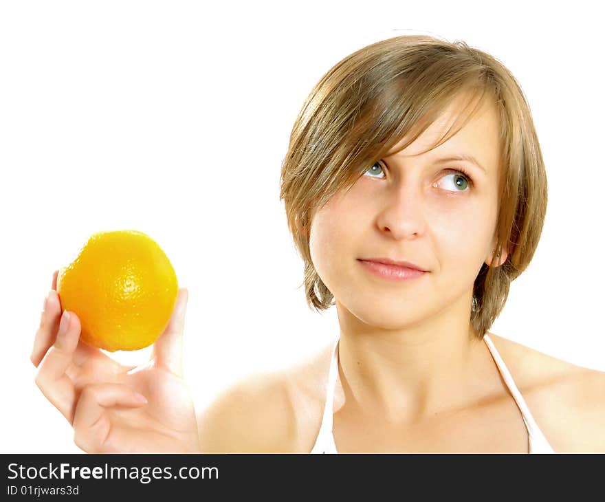 Portrait of a cute Caucasian blond girl with a nice colorful striped dress who is smiling and she is holding a fresh orange in her hand. Isolated on white. Portrait of a cute Caucasian blond girl with a nice colorful striped dress who is smiling and she is holding a fresh orange in her hand. Isolated on white.