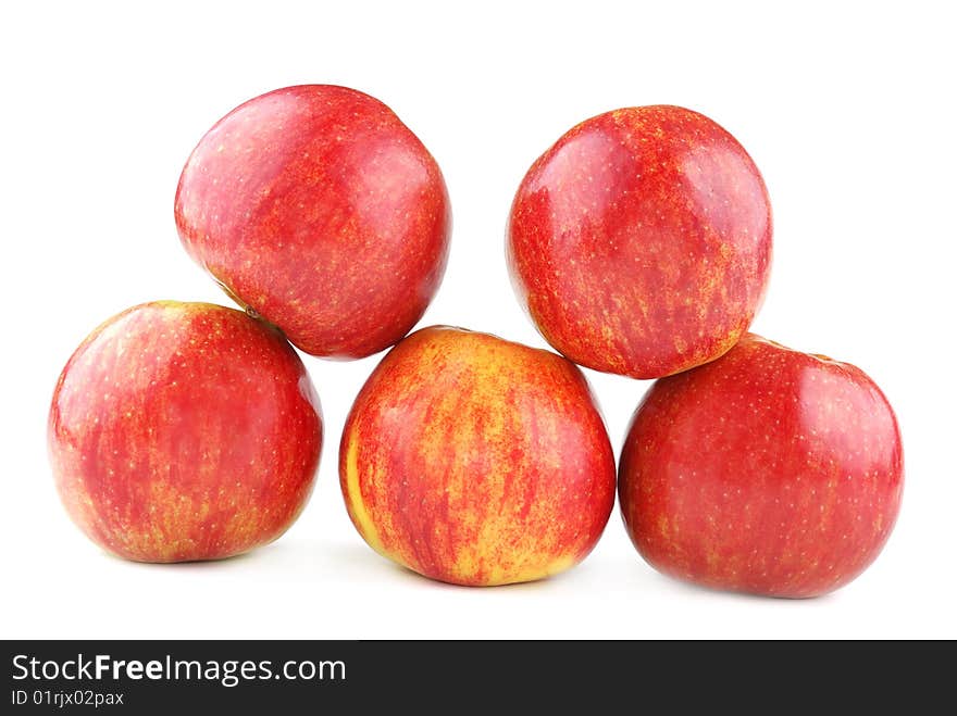 Red juicy apples with yellow points on sides.