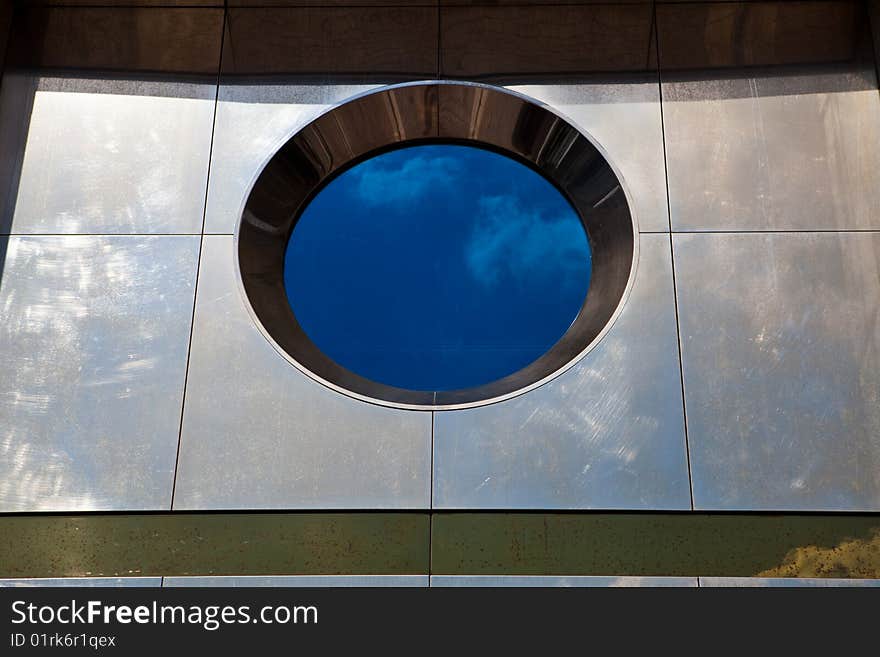 Round window with the reflected sky