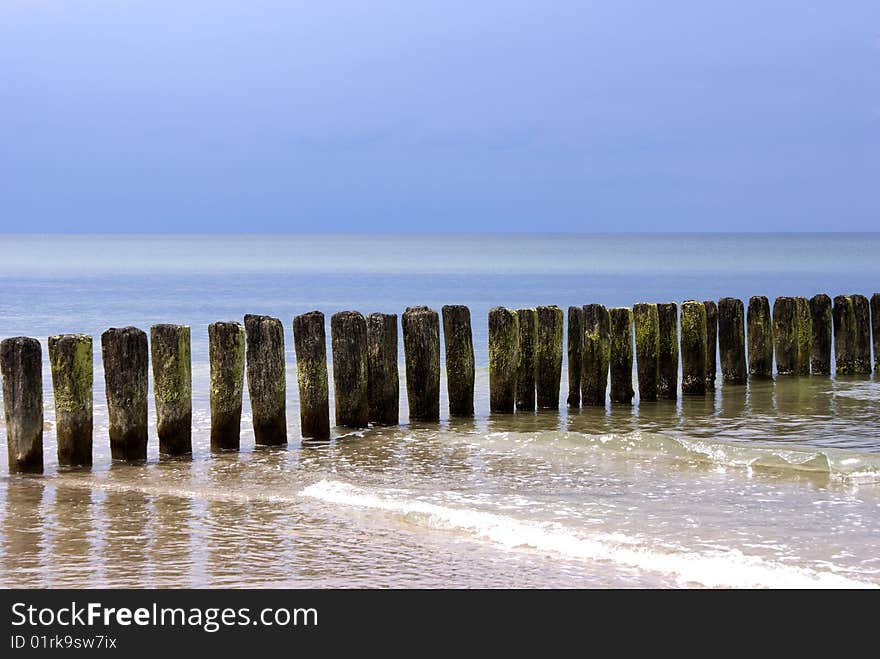 Breakwater in the Sea and blue sky