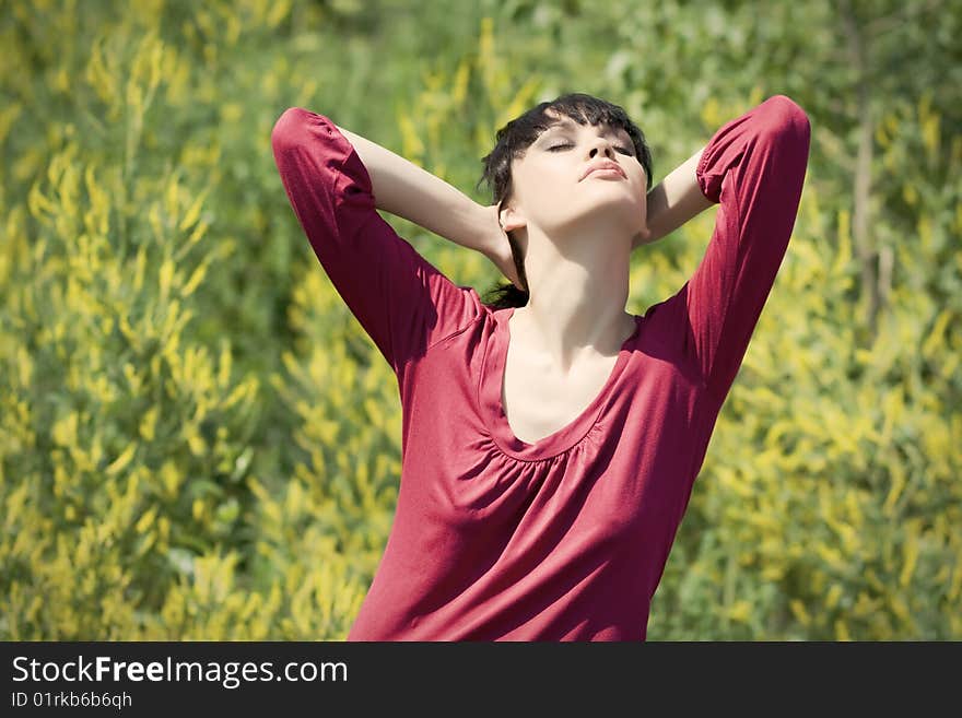 Relaxing Girl In The Grass.