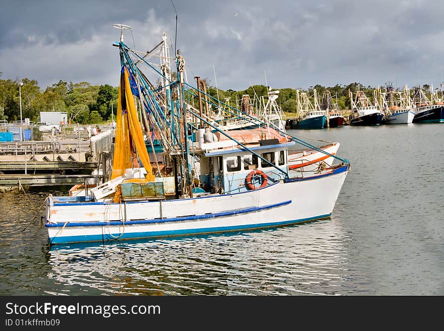 Fishing trawlers moored at docks