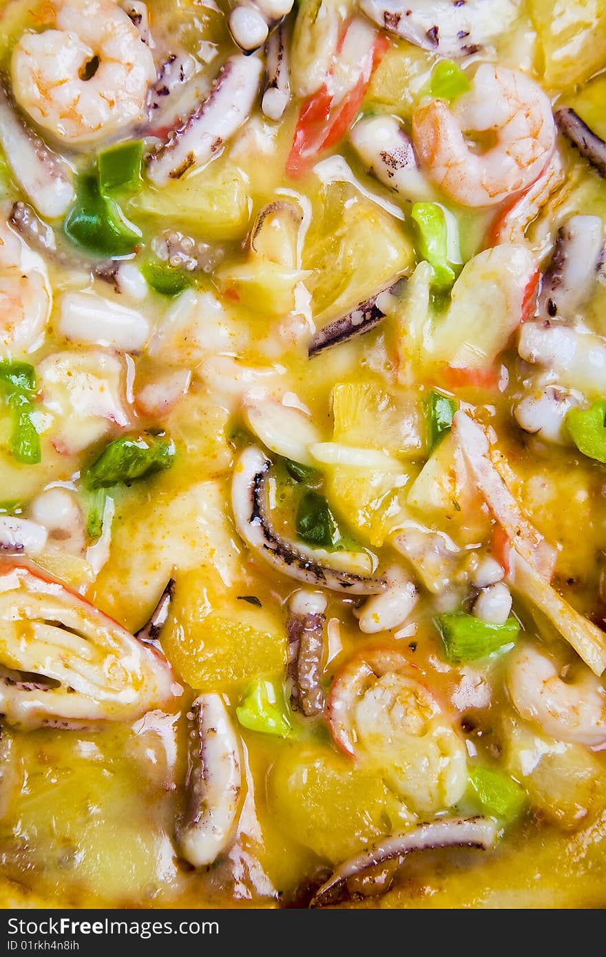 A close up of a seafood pizza.