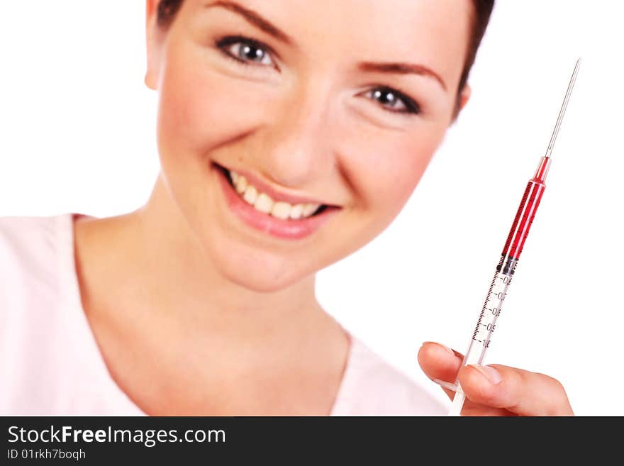 A pretty smiling nurse holding up a syringe with blood in it and looking at the camera on a white background. A pretty smiling nurse holding up a syringe with blood in it and looking at the camera on a white background.