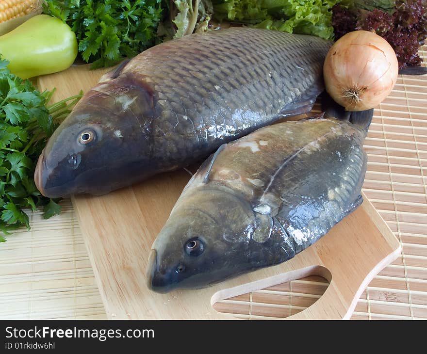 Carp fish close-up on chopping board