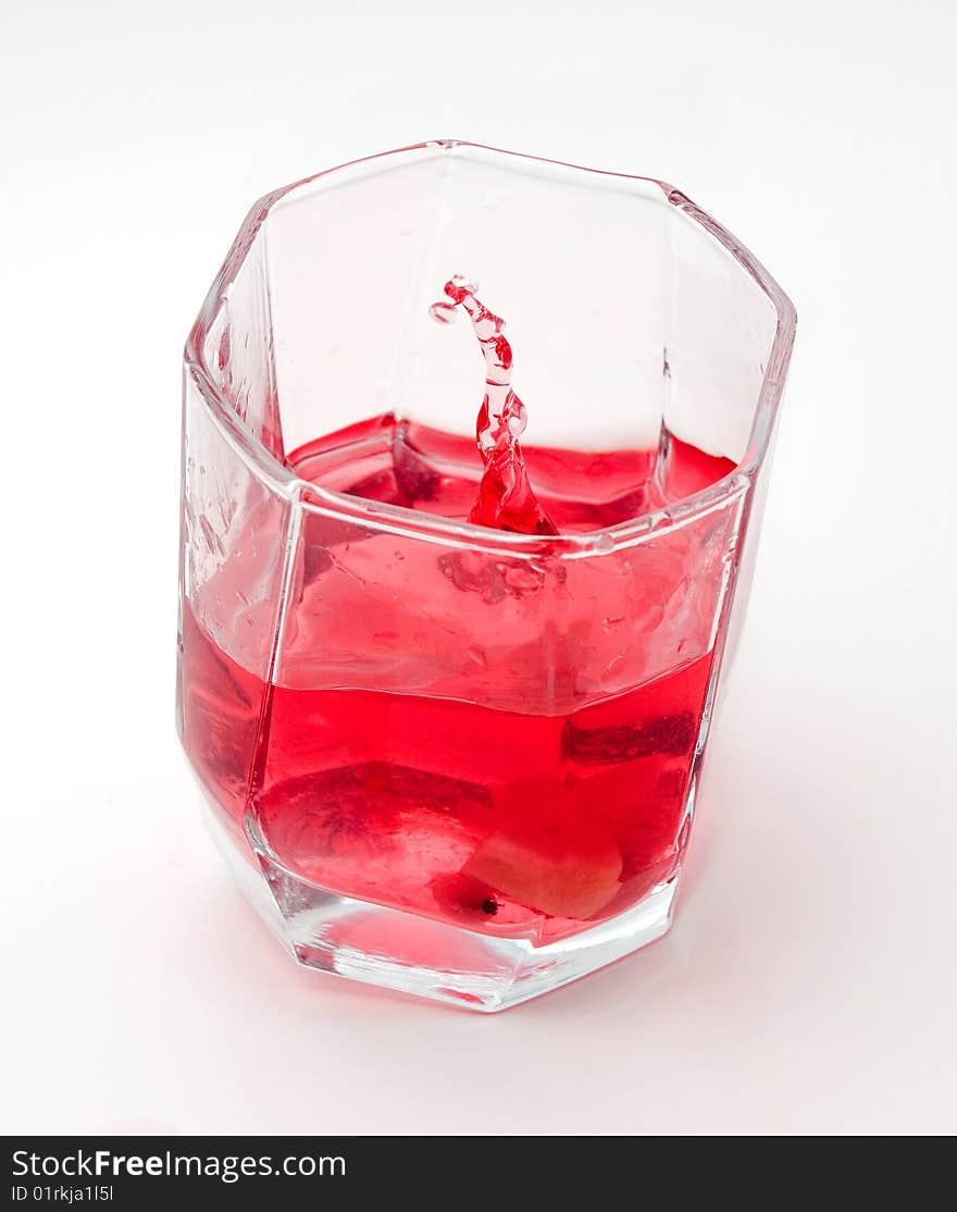 Red drink in a transparent glass. Red drink in a transparent glass