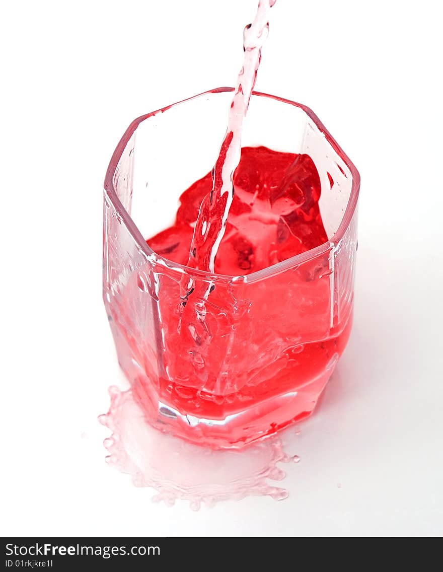 Red drink in a transparent glass. Red drink in a transparent glass