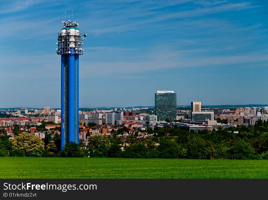 Water tower with antennas in Prague, Czech republic with antennas and a city skyline in the background. Water tower with antennas in Prague, Czech republic with antennas and a city skyline in the background