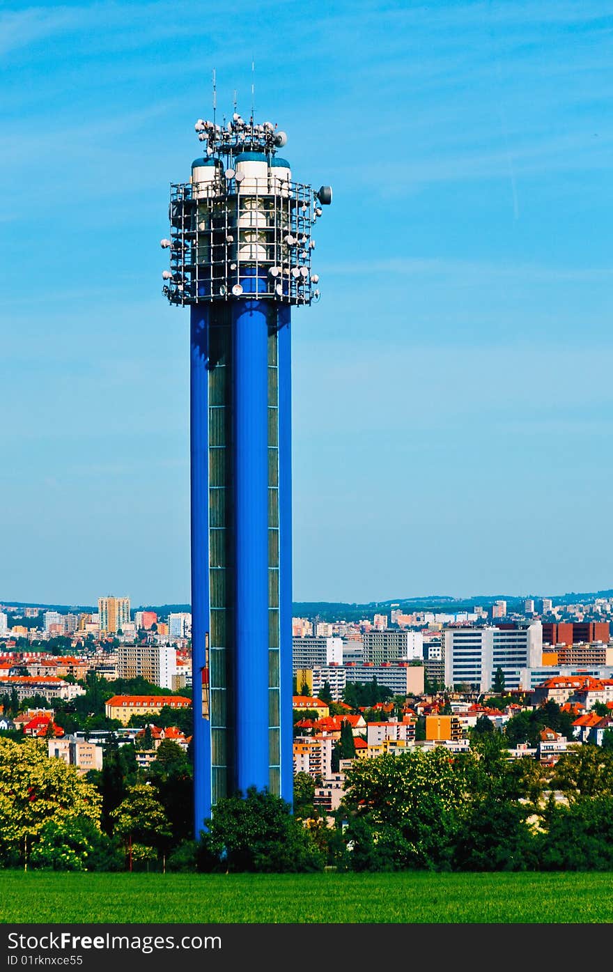 Water tower in Prague, Czech republic with a city skyline in the background