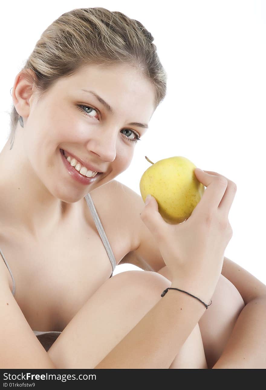 Beautiful young woman holding a  apple