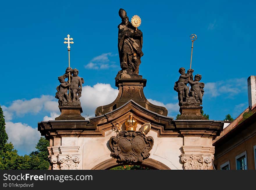 Monastery gate with sculpture of saint norbert in prague, czech republic