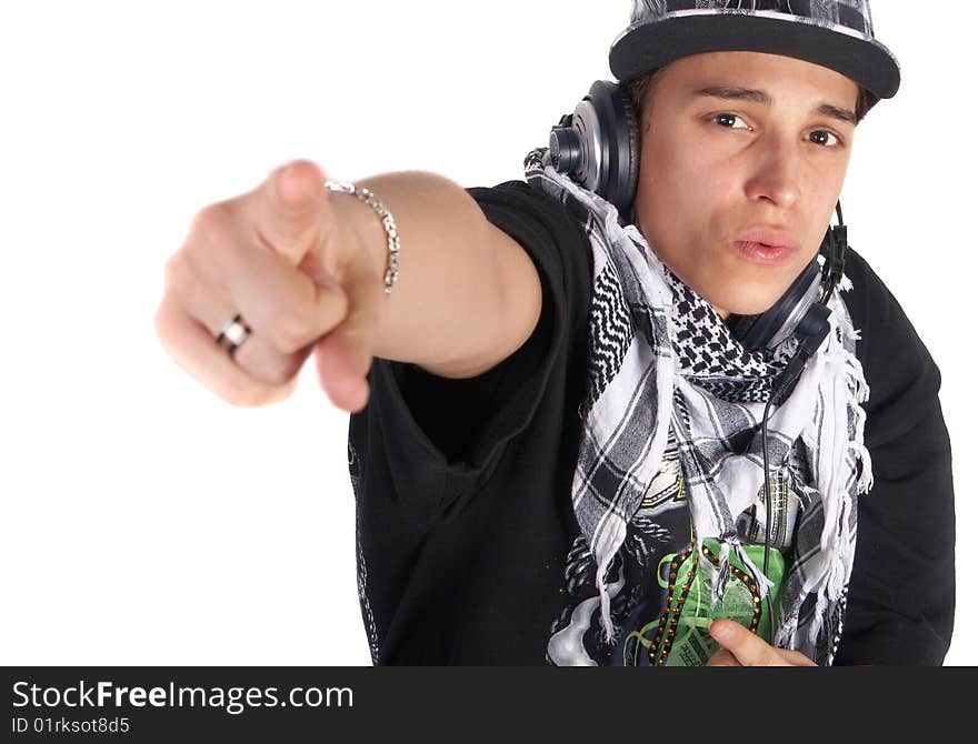 A young DJ is pointing up. He is listening to music on his headphones! Focus is on his face. Isolated over white. A young DJ is pointing up. He is listening to music on his headphones! Focus is on his face. Isolated over white.