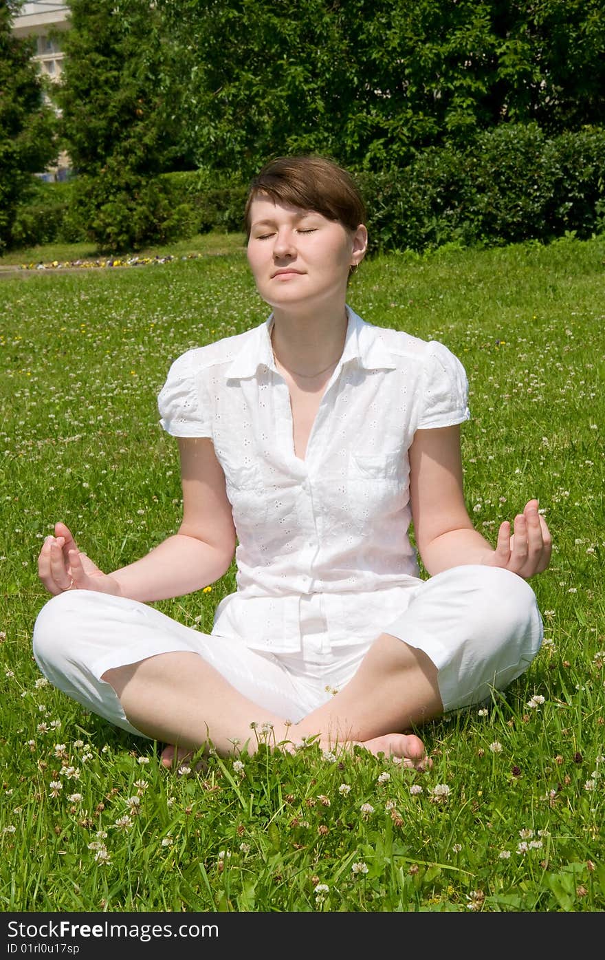 Young woman is relaxing in park. Young woman is relaxing in park