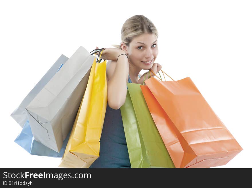 Young woman holding several shoppingbags.