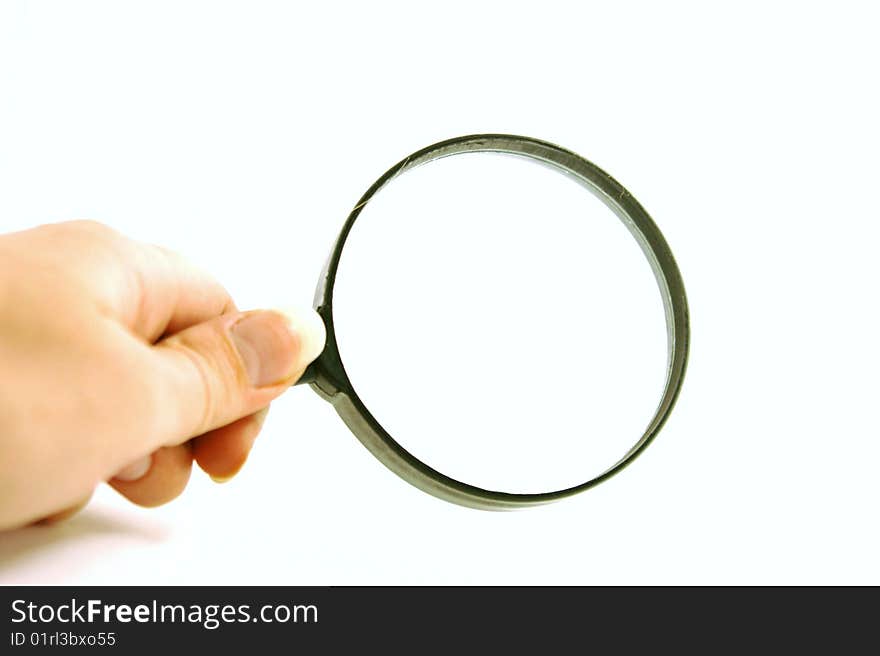 Magnifying glass on a white background, taken close-up,. Magnifying glass on a white background, taken close-up,