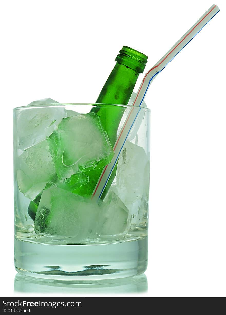 Cocktail: glass with ice and green bottle. Cocktail: glass with ice and green bottle