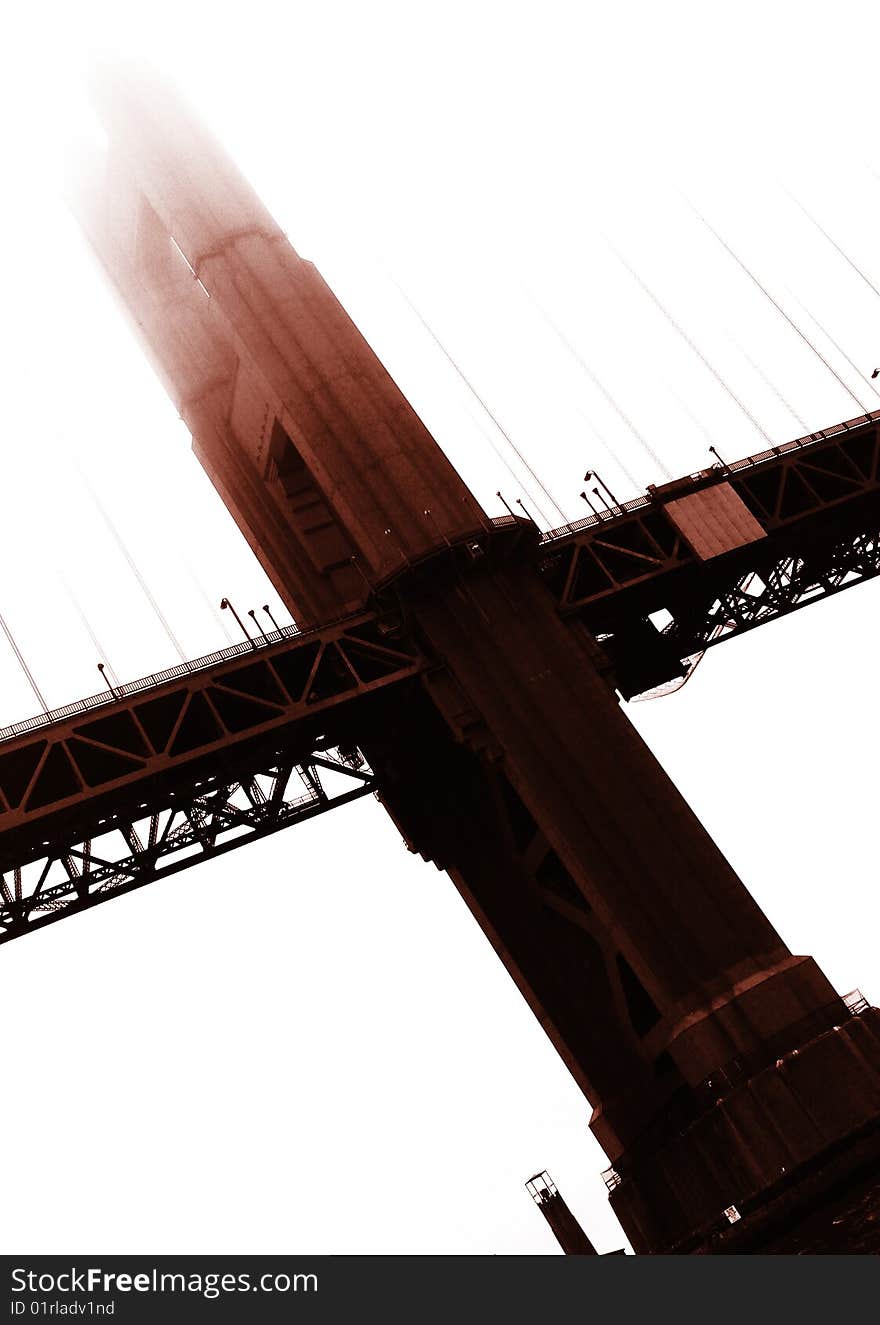 San Francisco Golden Gate Bridge on a foggy day from the water's perspective.