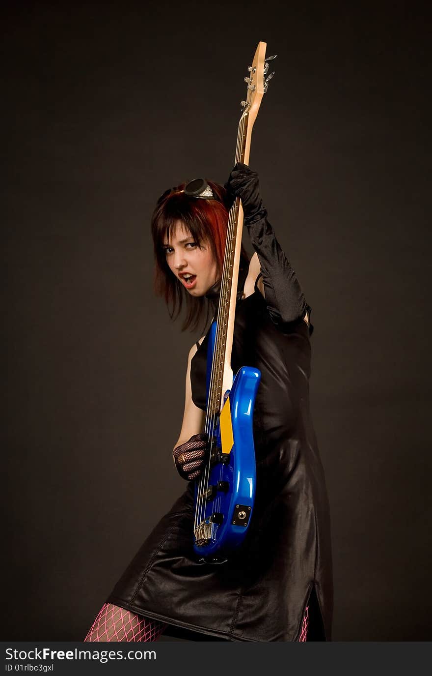 Screaming rock girl with bass guitar. Screaming rock girl with bass guitar