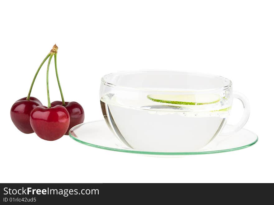 Cup of water with lemon and cherries, isolated on white background