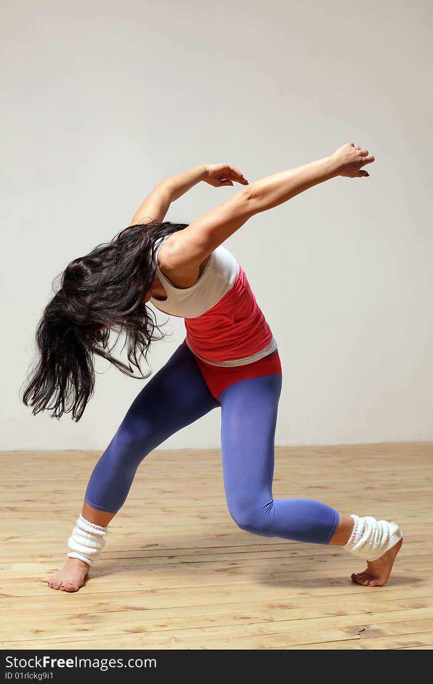 Modern style dancer posing on studio background. Modern style dancer posing on studio background