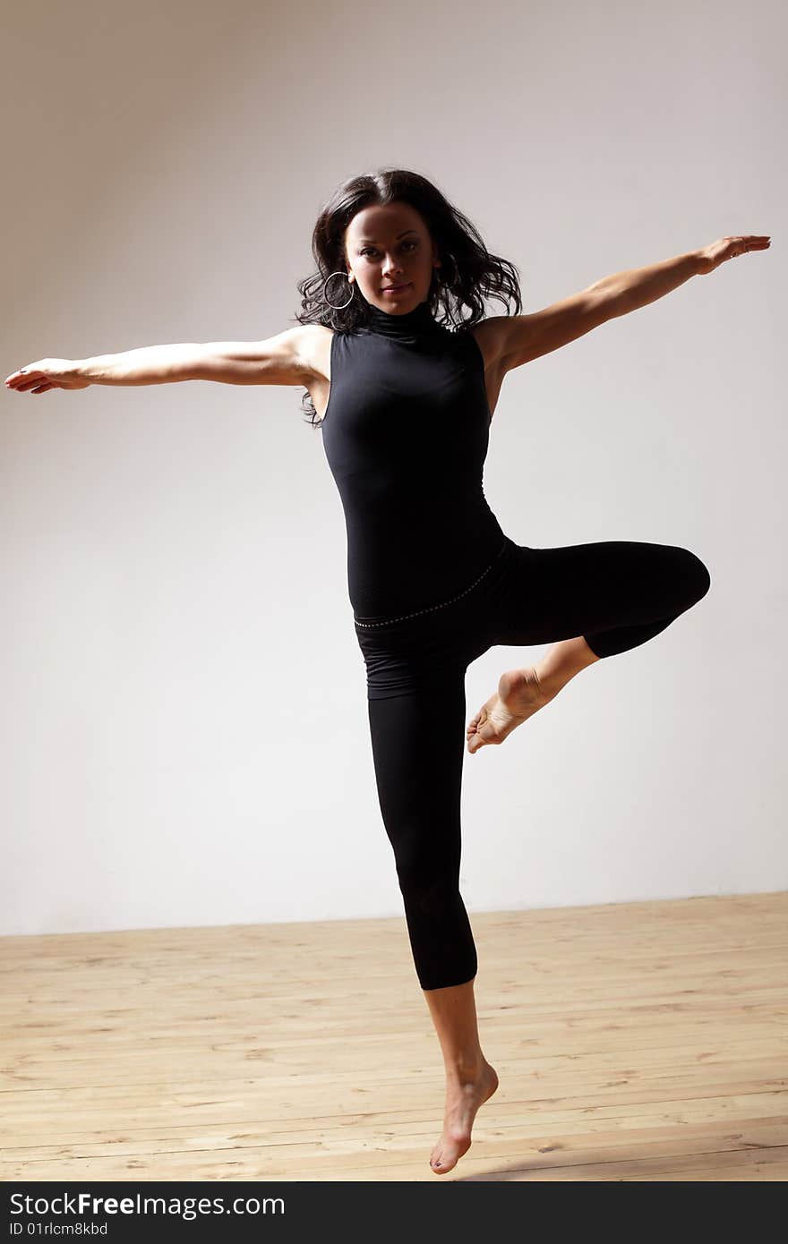 Modern style dancer posing on studio background. Modern style dancer posing on studio background