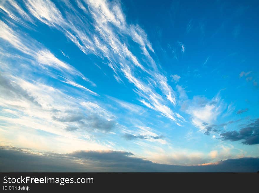 White fluffy clouds in the blue sky in summertime. White fluffy clouds in the blue sky in summertime