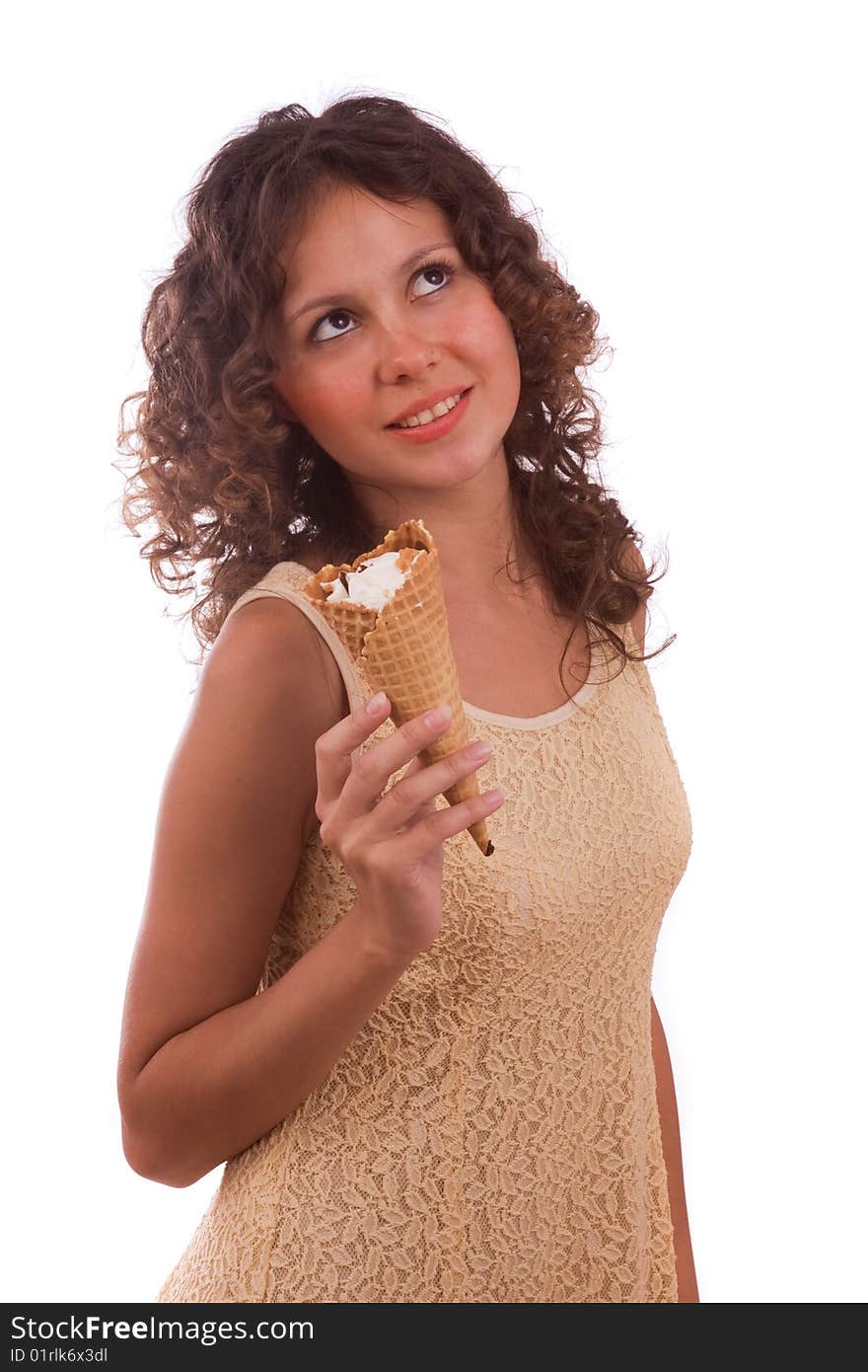 Pretty young woman is eating an ice cream cone. Picture of lovely girl with ice cream. Isolated over white background.