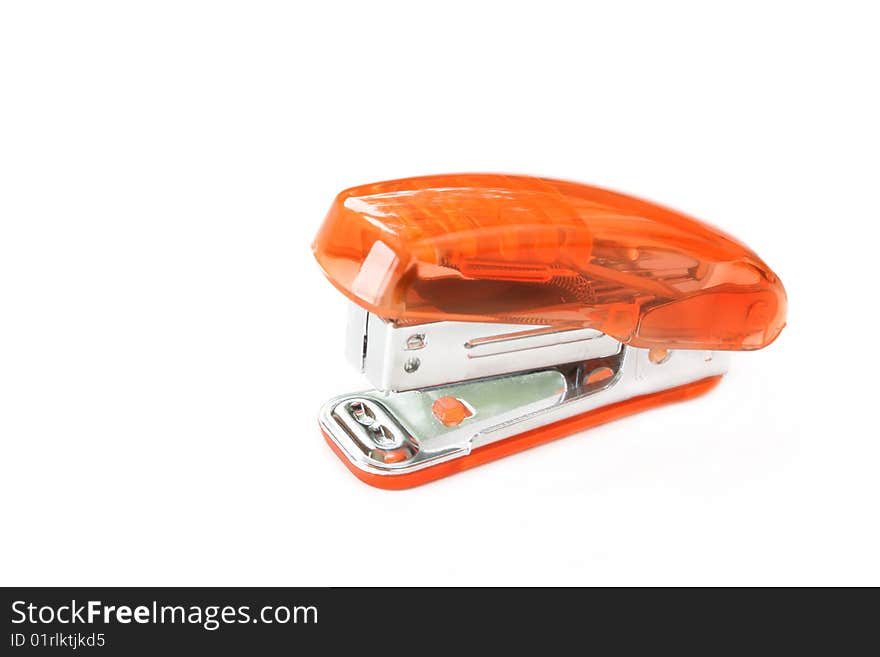 Orange stapler isolated on a white background with room for text.