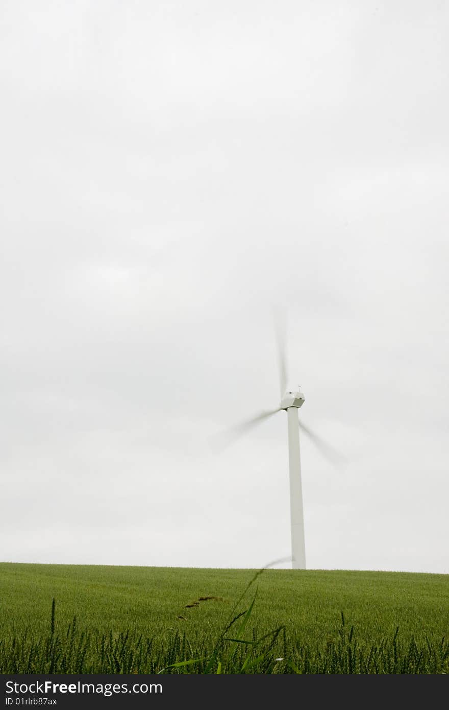 Wind turbine with fresh green grass. Wind turbine with fresh green grass