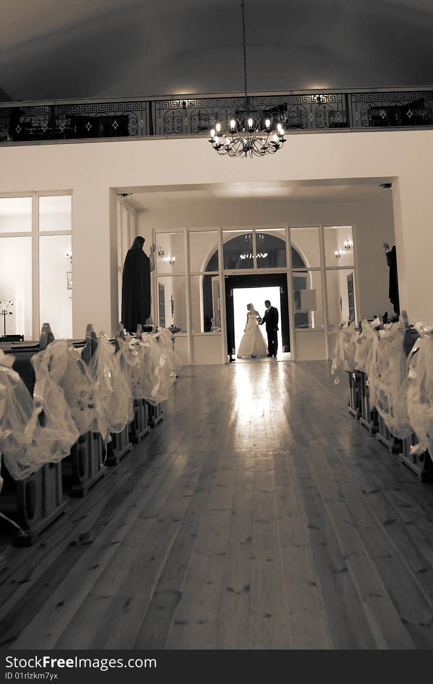 Bride and groom standing in church doorway. Bride and groom standing in church doorway