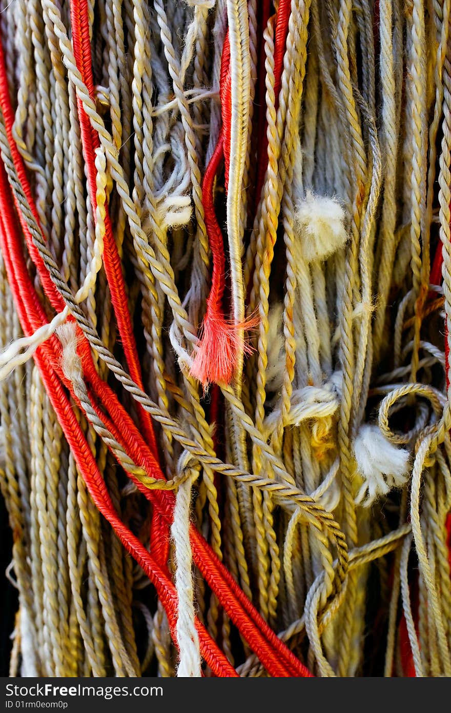 Tangled colorful ropes macro background. Tangled colorful ropes macro background