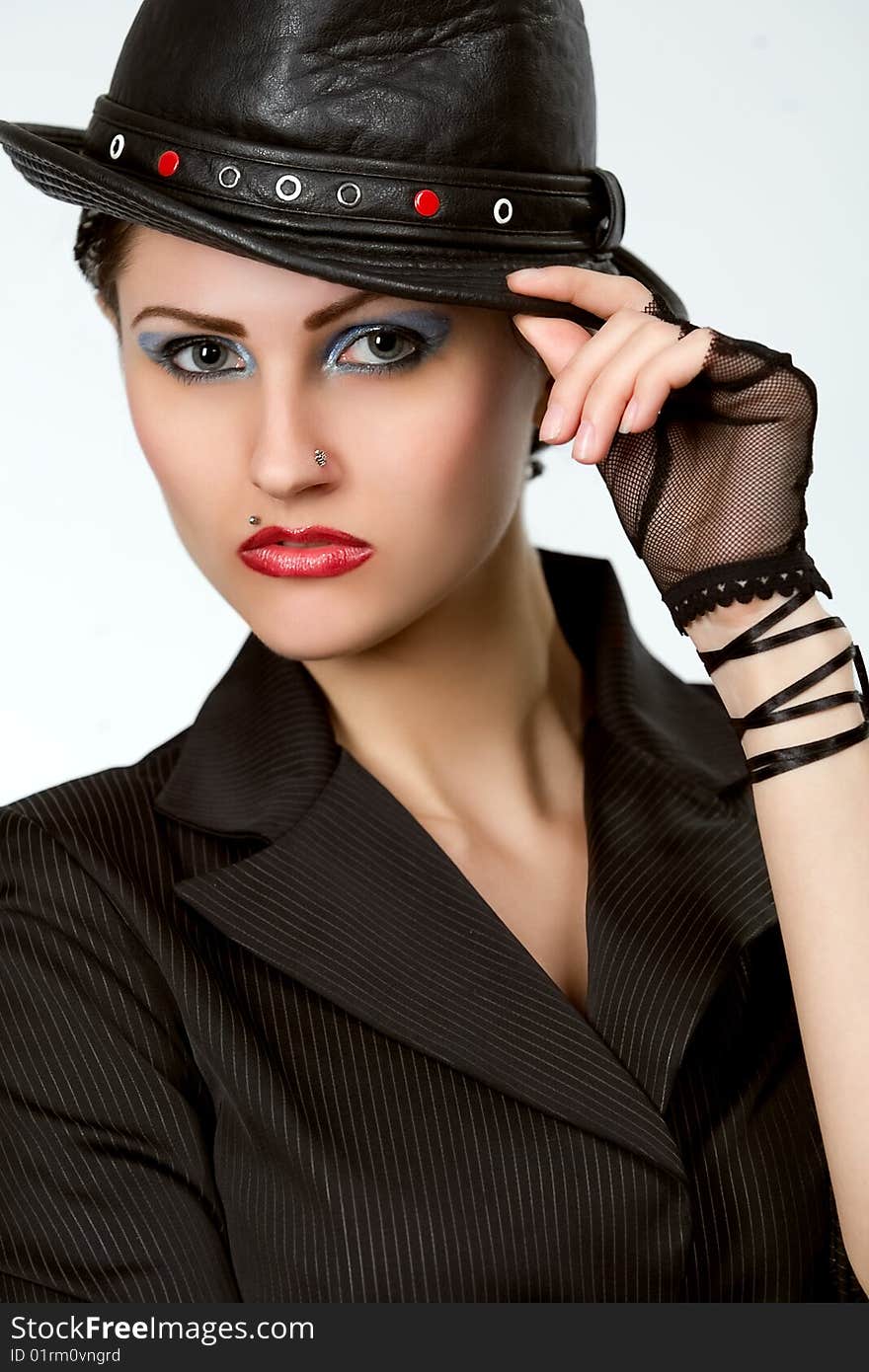 Young fashionable model with black hat