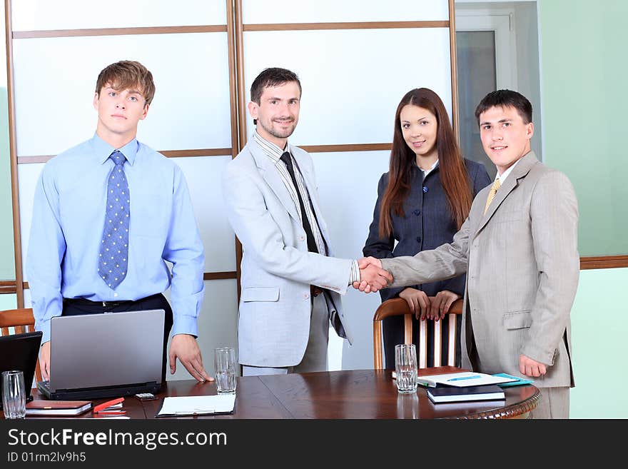 Business theme: business team in a work process in office. Business theme: business team in a work process in office.