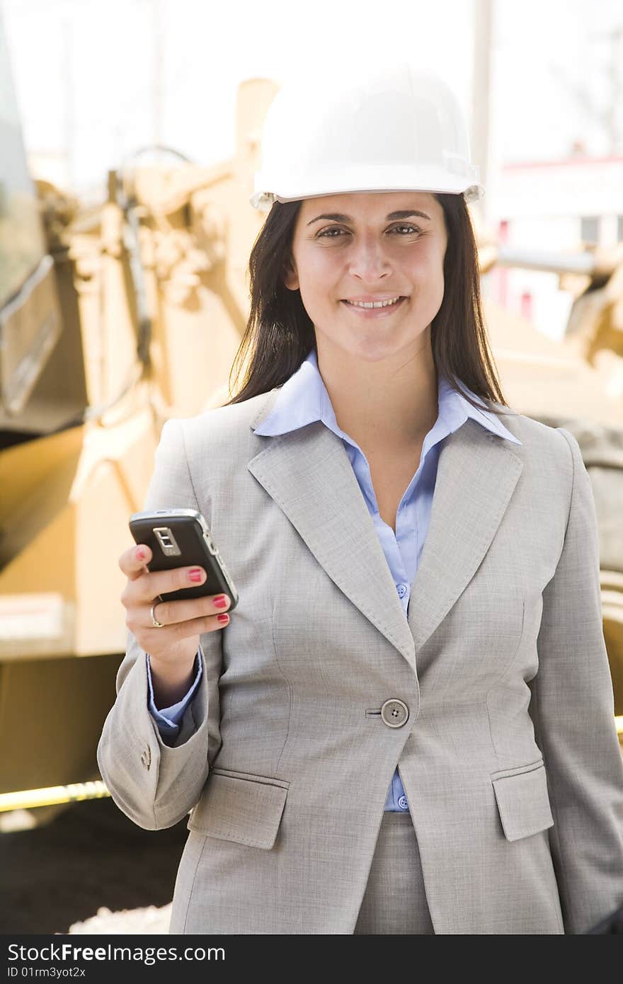 Female worker at a construction site. Female worker at a construction site